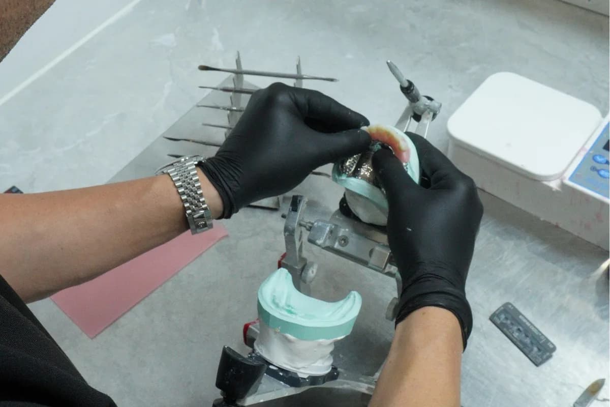 A technician working on a model in the Dental Spot lab