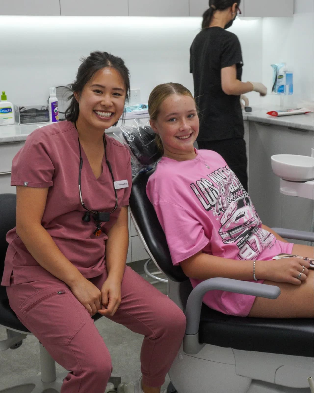 Dr Amanda Zhong with a smiling young patient in the chair