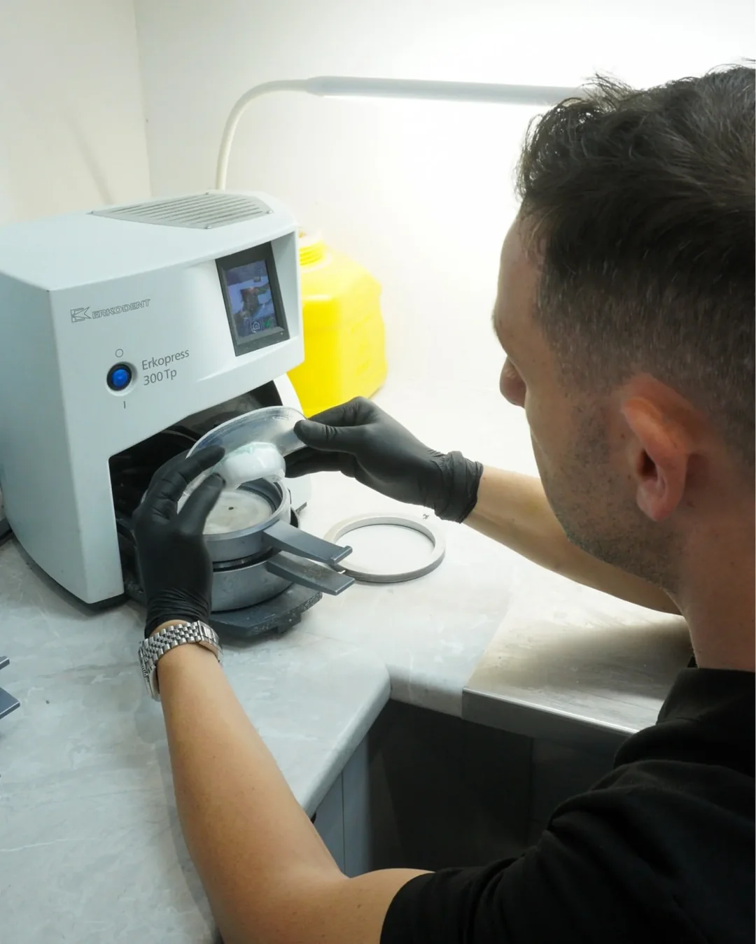 A technician making a mouthguard in the Dental Spot lab