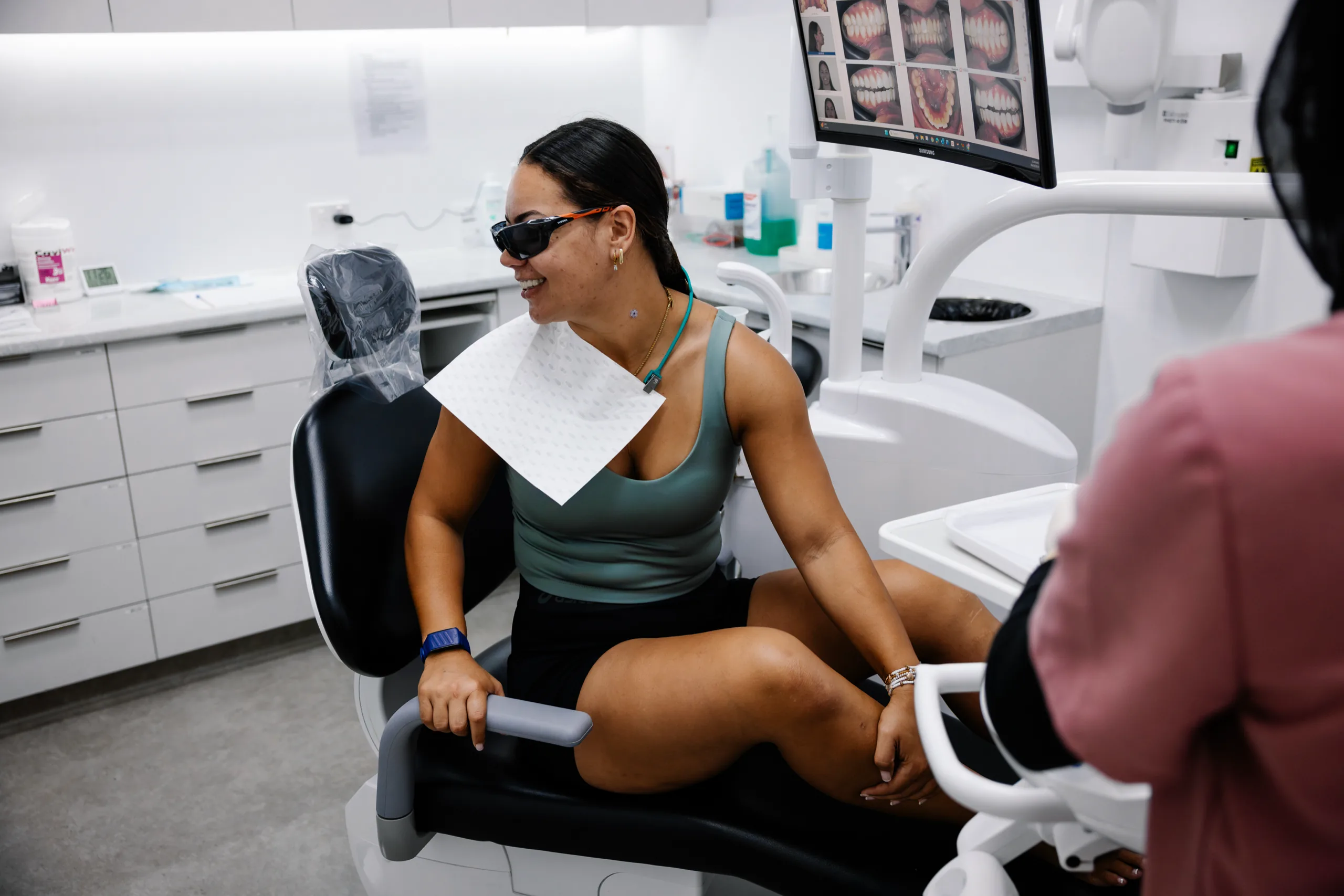 A patient smiling and relaxed in the dental chair